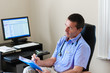 Photo: Doctor Writing On A Document Doctor Writing On A Document