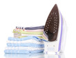 iron and towels isolated on white
