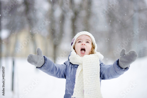 Photo: Little girl having fun at winter Little girl having fun at winter