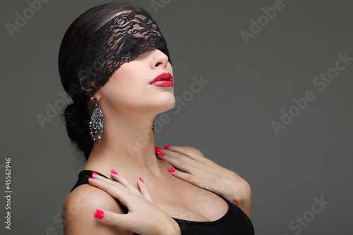 Photo: portrait elegant sexual brunette woman is in a black lace mask portrait elegant sexual brunette woman is in a black lace mask