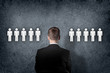 Businessman choosing between people