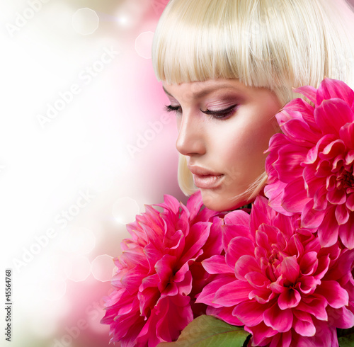 Photo: Fashion Blond Girl with Big Pink Flowers Fashion Blond Girl with Big Pink Flowers