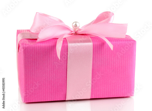 Photo: Colorful pink gift with bow isolated on white Colorful pink gift with bow isolated on white
