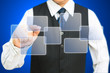 Photo: Business man pressing a touchscreen button Business man pressing a touchscreen button