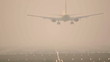 Jet airplane landing, early morning.
