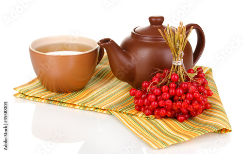 Photo: tea with red viburnum isolated on white tea with red viburnum isolated on white