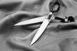 Scissors on a black leather background