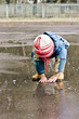 Baby washes up on the road in a pool.