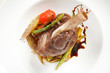 lamb chops on a bed of vegetables