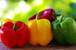 red, yellow and green pepper on green background
