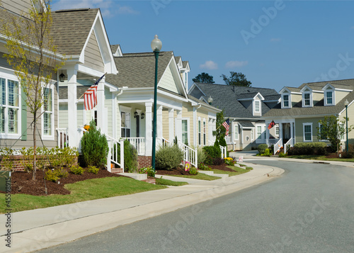 Photo: Street of residential cottage style homes Street of residential cottage style homes