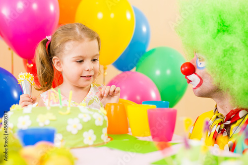 Photo: happy child girl with clown on birthday party happy child girl with clown on birthday party