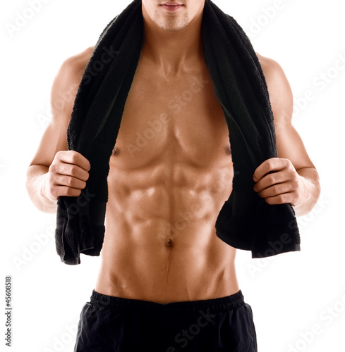 Photo: Sexy body of muscular athletic man with towel on the shoulders Sexy body of muscular athletic man with towel on the shoulders