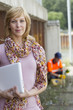 Photo: Casual businesswoman carrying laptop Casual businesswoman carrying laptop