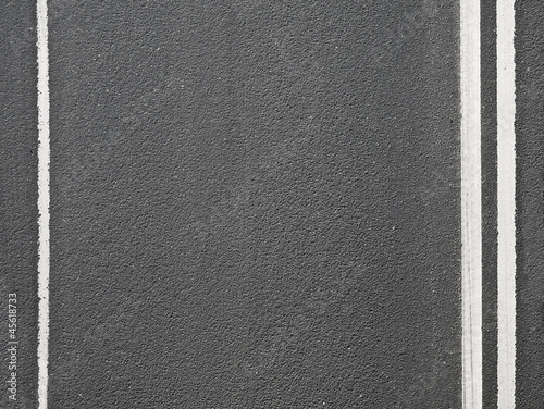 Photo: Close-up texture of an asphalt road with marking Close-up texture of an asphalt road with marking