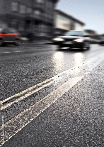 Photo: On the wet road with fast approaching cars On the wet road with fast approaching cars