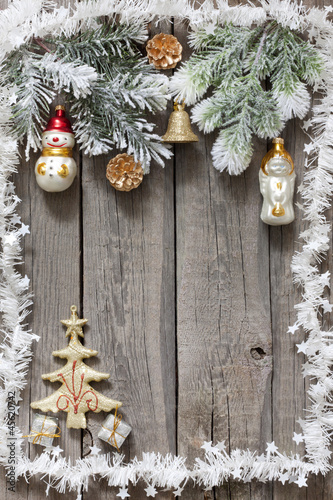 Photo: Christmas tree baubles background on vintage wooden boards Christmas tree baubles background on vintage wooden boards