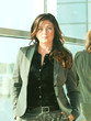busineeslady in grey pantsuit portrait