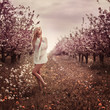 beautiful blonde in the garden in spring