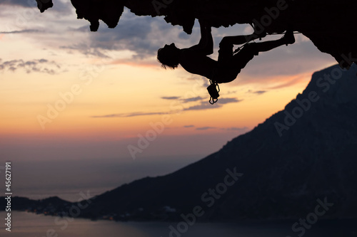 Fototapeta Silhouette of a rock climber at sunset. Kalymnos Island, Greece.