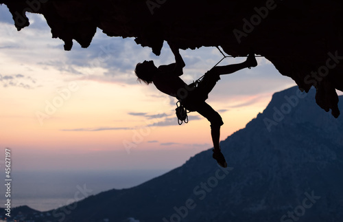  Silhouette of a rock climber at sunset. Kalymnos Island, Greece.