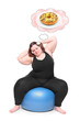 Foto: Overweight woman practising with ball and her sweet dreams. Overweight woman practising with ball and her sweet dreams.