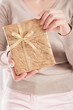 Christmas present in golden wrap