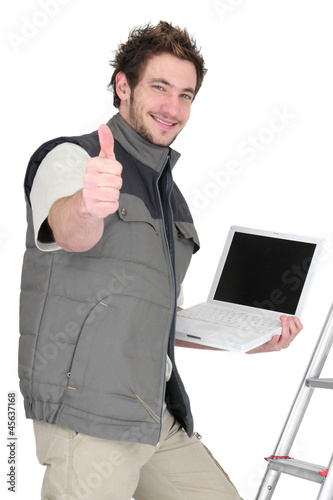 Photo: Tradesman posing with his tools and giving the thumb's up Tradesman posing with his tools and giving the thumb's up