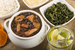 Feijoada - Brazilian meat & bean stew, side dishes & caipirinha