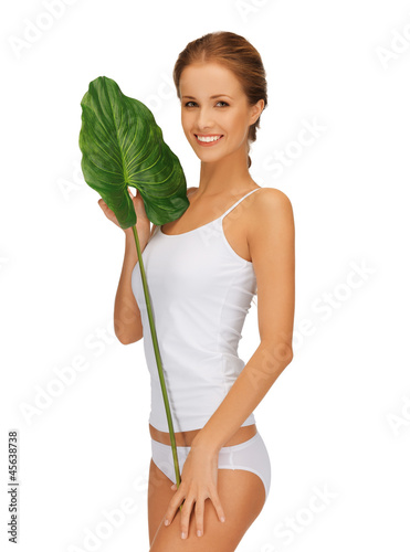 Photo: lovely woman with green leaf lovely woman with green leaf