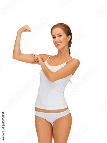 Photo: woman in cotton undrewear flexing her biceps woman in cotton undrewear flexing her biceps