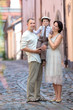 Young family of three in city street