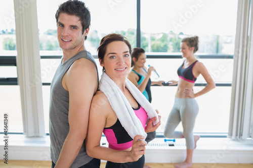 Photo: Man and woman standing back to back Man and woman standing back to back