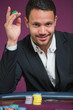 Man holding chip between his fingers