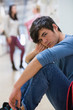 Man sitting on the floor looking