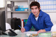 Young worker in warehouse