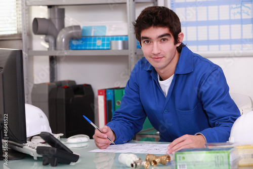 Photo: Young worker in warehouse Young worker in warehouse