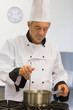 Chef cooking sauce