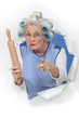 grandma with hair curlers threatening someone with rolling pin