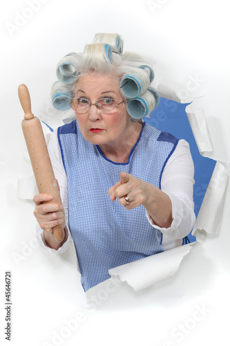Photo: grandma with hair curlers threatening someone with rolling pin grandma with hair curlers threatening someone with rolling pin