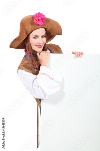 Photo: Woman in fancy dress holding message board Woman in fancy dress holding message board
