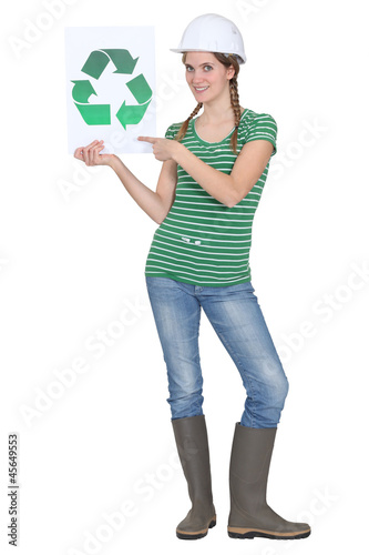 Photo: Woman holding recycle logo Woman holding recycle logo
