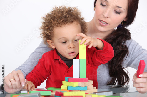 Photo: Woman and child playing with building blocks Woman and child playing with building blocks