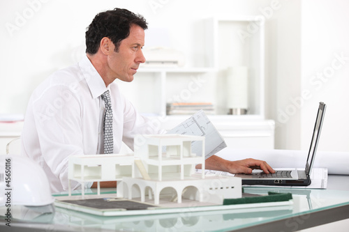 Photo: Architect working in his office Architect working in his office