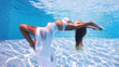 Photo: Underwater woman fashion portrait in swimming pool. Underwater woman fashion portrait in swimming pool.
