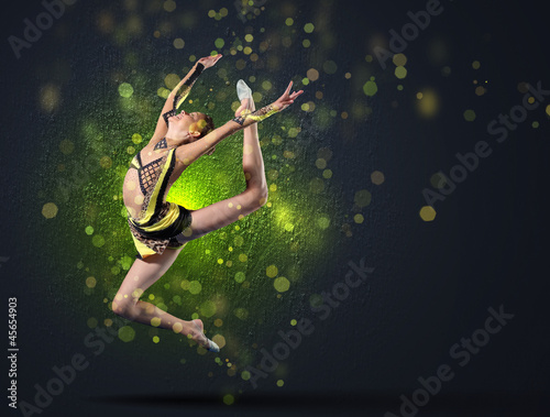Photo: Young woman in gymnast suit posing Young woman in gymnast suit posing
