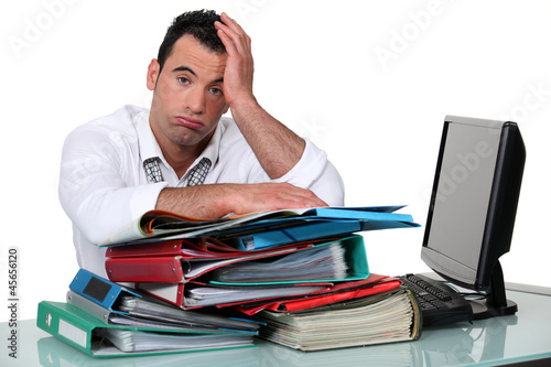 Photo: Overworked office worker Overworked office worker