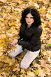 Autumn woman on leafs