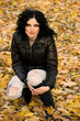 Autumn woman on leafs