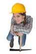 Leaning against her pickaxe